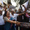 AAP workers and supporters celebrate party's victory in Delhi Municipal Corporation election at Fort in Mumbai.