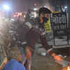 Article image for: Shopkeepers warming from fire during cold waves