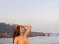 Actor Nikkita Ghag flaunts an orange bikini, & says "Colors are not associated with any religion."