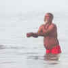 Article image for: WB: Devotees take holy dip in Ganga in <i class="tbold">south 24 parganas</i> on Makar Sankranti