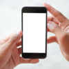 Holding phone with both hands and using only one thumb