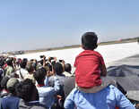 Children enjoy the display at the 14th edition of Aero India