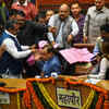 BJP councillor Amit Nagpal throws the torn ballot papers infront of mayor at the civic centre