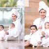 Article image for: <i class="tbold">debina bonnerjee</i> makes for a cute sight as she twins with daughters in white bathrobe by the poolside; watch