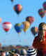 Watching hundreds of colorful hot-air balloons ascend into the dawn sky