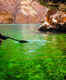 Kayak over emerald-colored water