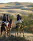 Camel safari and watching sunset at Khuri Dunes