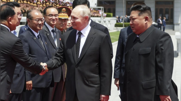 Vladimir Putin embraced with smiles, handshakes, and hugs from Kim Jong ...