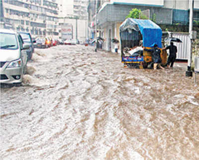 Rain battered city crawls, collapses