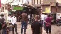 Lockdown 3.0: Delhiites maintain social distancing norms outside liquor shop in Jhandewalan 
