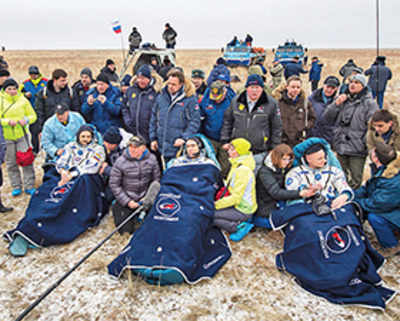US, Russian astronauts return after year in space
