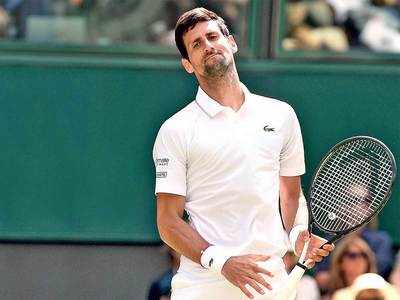 Novak Djokovic starts Wimbledon title defence with straight-sets victory over Philipp Kohlschreiber