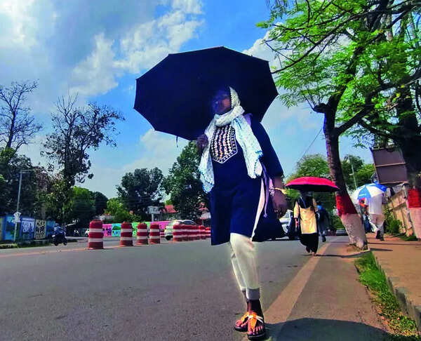 Rain, hailstorm cool city, bring flight disruptions