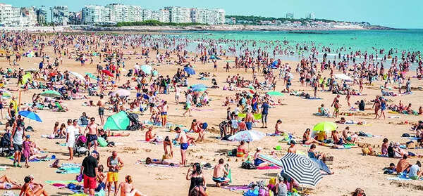 A French beach town's plea to tourists: Keep your clothes on in markets