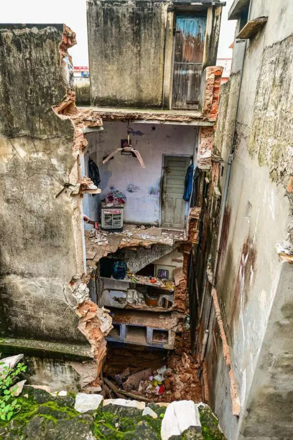 2 killed as 100-year-old building collapses amid heavy rain in city