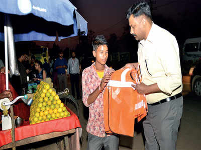 Techie distributes reflector vests to people on the street