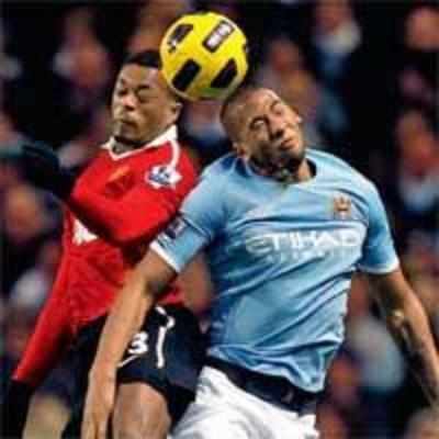 Manchester derby ends in tame draw