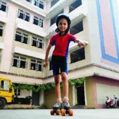City girl wins triple medal at district skating tourney