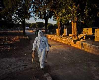 As toll mounts, Brazil to dig up old graves for space