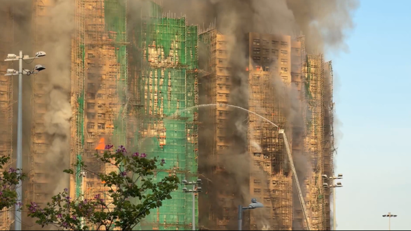 Massive fire engulfs multiple high rises in Hong Kong; death toll climbs to 13 - video