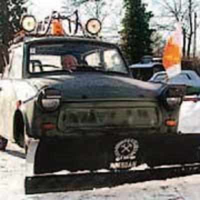 Inventor uses car to create snow plough