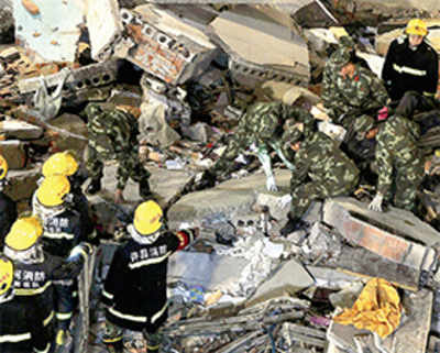 17 killed in building collapse, quake destroys 12,000 houses