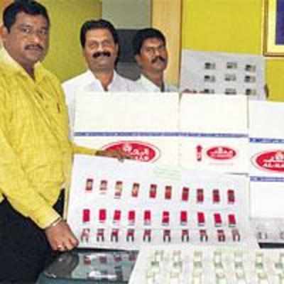 Two held for producing fake perfume label