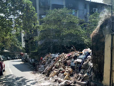 Discarded debris blocks road in Mazgaon