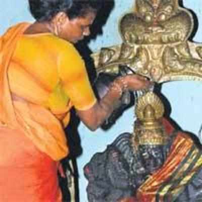 Armed with court order, woman priest breaks locks, performs puja