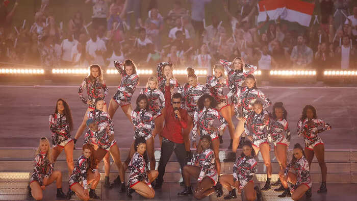 DJ Apache Indian performs during the closing ceremony