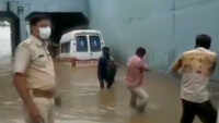 Gujarat: People pull out ambulance stuck in waterlogged underpass 