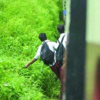 School boys get set for train stunts... and fatal falls