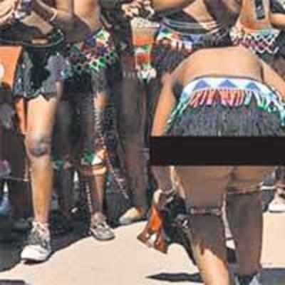 Zulu girls cover up after tourists take pictures