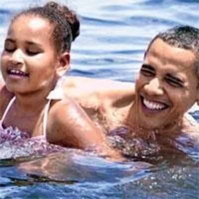 Obama takes dip as act of reassurance