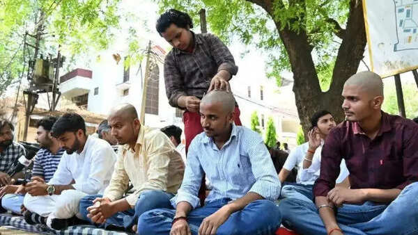 Varanasi college campus death case: Students tonsure head, stage sit-in, demand removal of principal