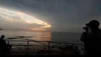 People gather to witness sunrise at Tenneti Park in Visakhapatnam 