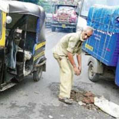 An autowallah who fills potholes at top speed