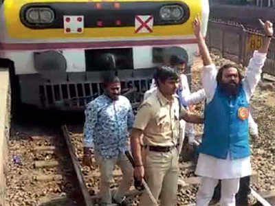Four detained as protesters try to block railway tracks