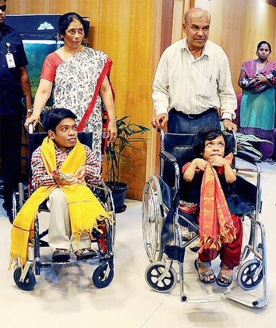 SBI plays good samaritan; Gifts Rs 1.85 lakhs each for siblings ' wheelchairs