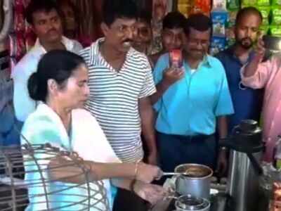 West Bengal Chief Minister Mamata Banerjee makes tea at a tea shop, serves locals