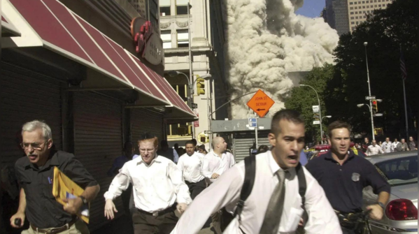 People run from collapsing tower