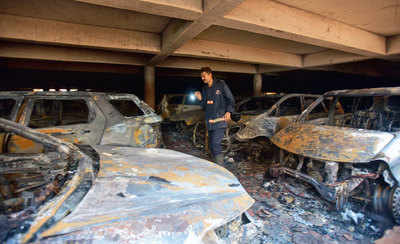 15 cars charred as heat sparks fire in parking lot