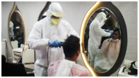 Lockdown 4.0: Salon barbers wear PPE suits, face shield in Surat 