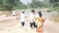 Watch: Locals help woman cross flooded river in AP’s Krishna district 