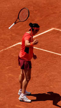 ​Jabeur throws her <i class="tbold">racket</i> in agony