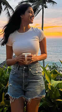 <i class="tbold">voluptuous</i> in a simple white T-shirt by the beach