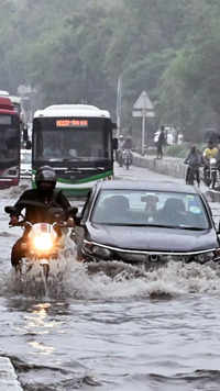 Vehicles wade through a waterlogged road in Delhi.