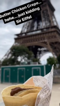 Enjoying <i class="tbold">crepes</i> at the Eiffel Tower