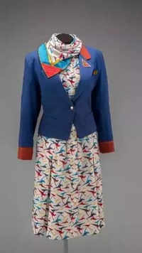 1980s: <i class="tbold">qantas airways</i> female flight attendant uniform by Yves Saint Laurent