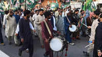 Supporters of Pakistan's former Prime Minister <i class="tbold">Nawaz Sharif</i> await for his arrival in Lahore.​